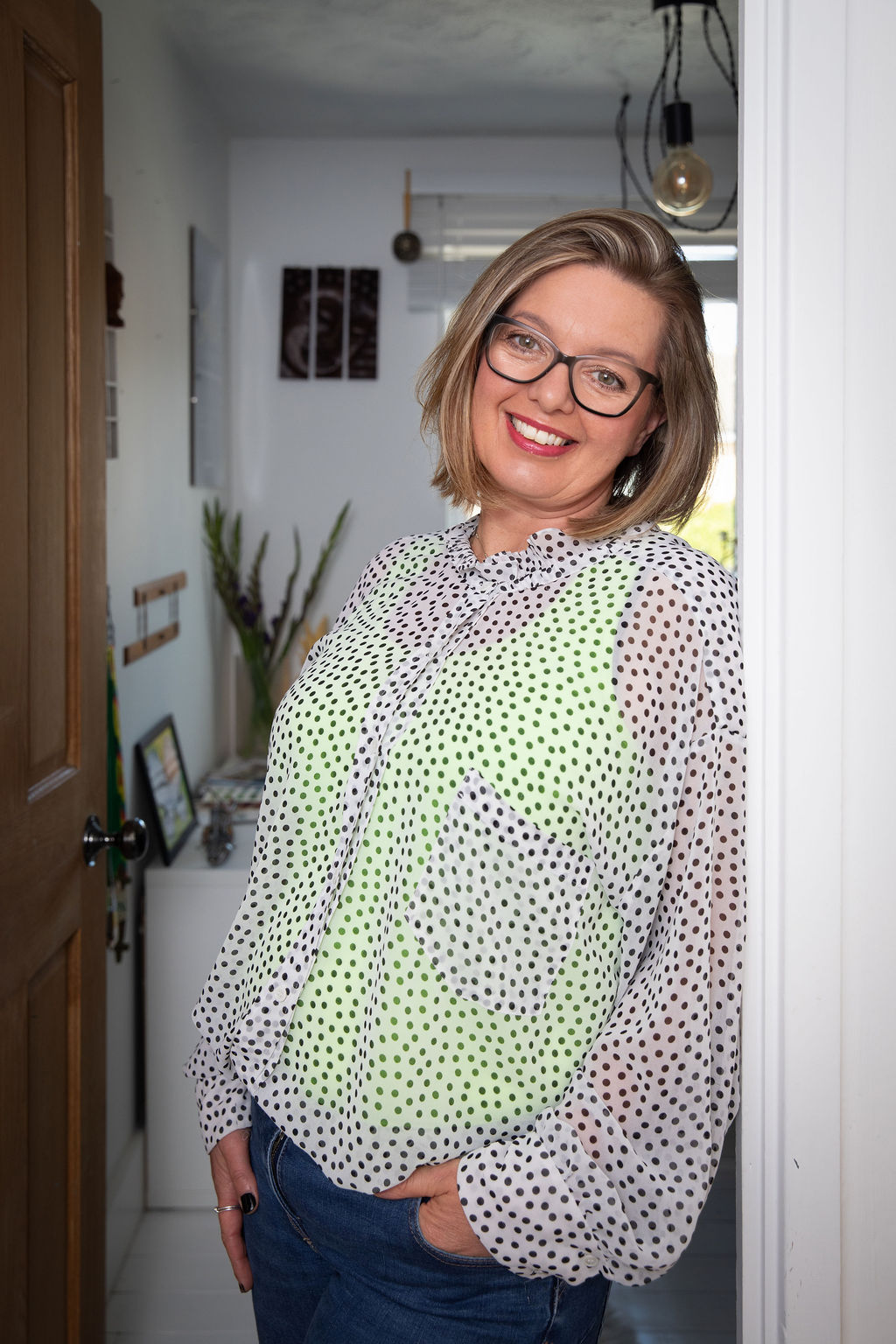 Gini in doorway of office<br />
